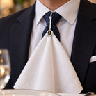 Masonic Square and Compasses napkin hook holding a white serviette with formal suit and tie