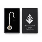 Silver-coloured Masonic napkin holder laid inside presentation box