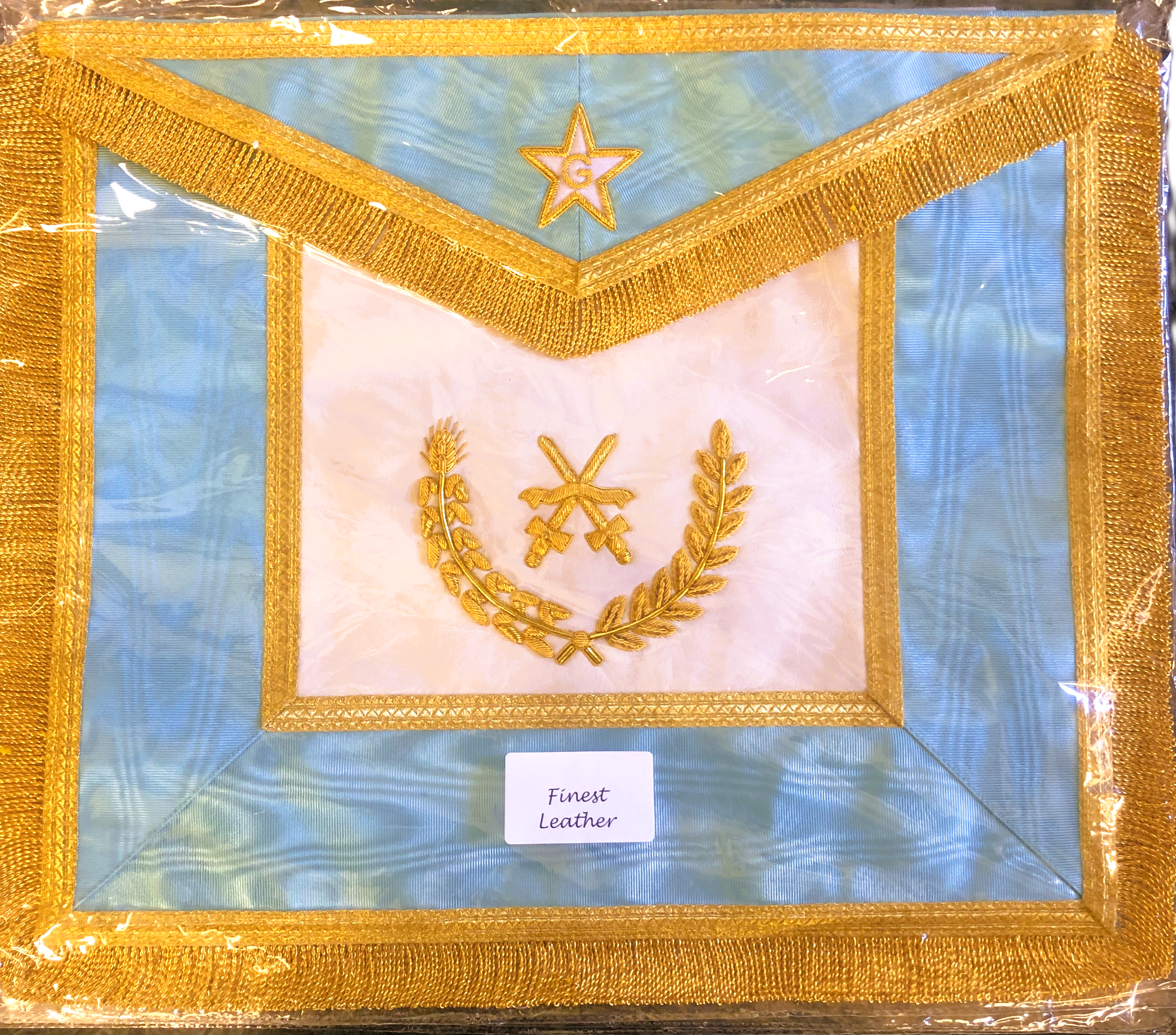 Decorative Masonic Apron for the Netherlands with gold embroidery on a blue background, labeled 'Finest Leather'.