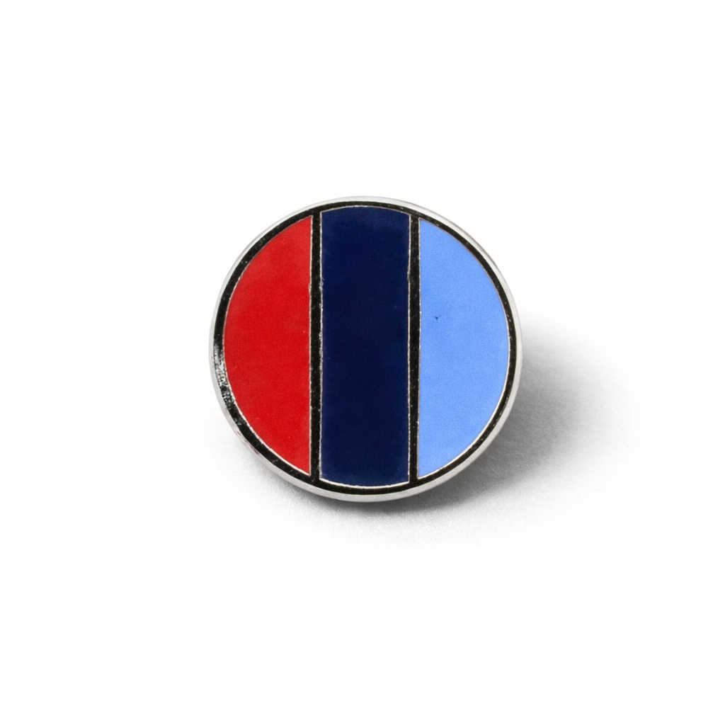 Front view of one journey silver-tone round Masonic lapel featuring in light blue, dark blue, and red.