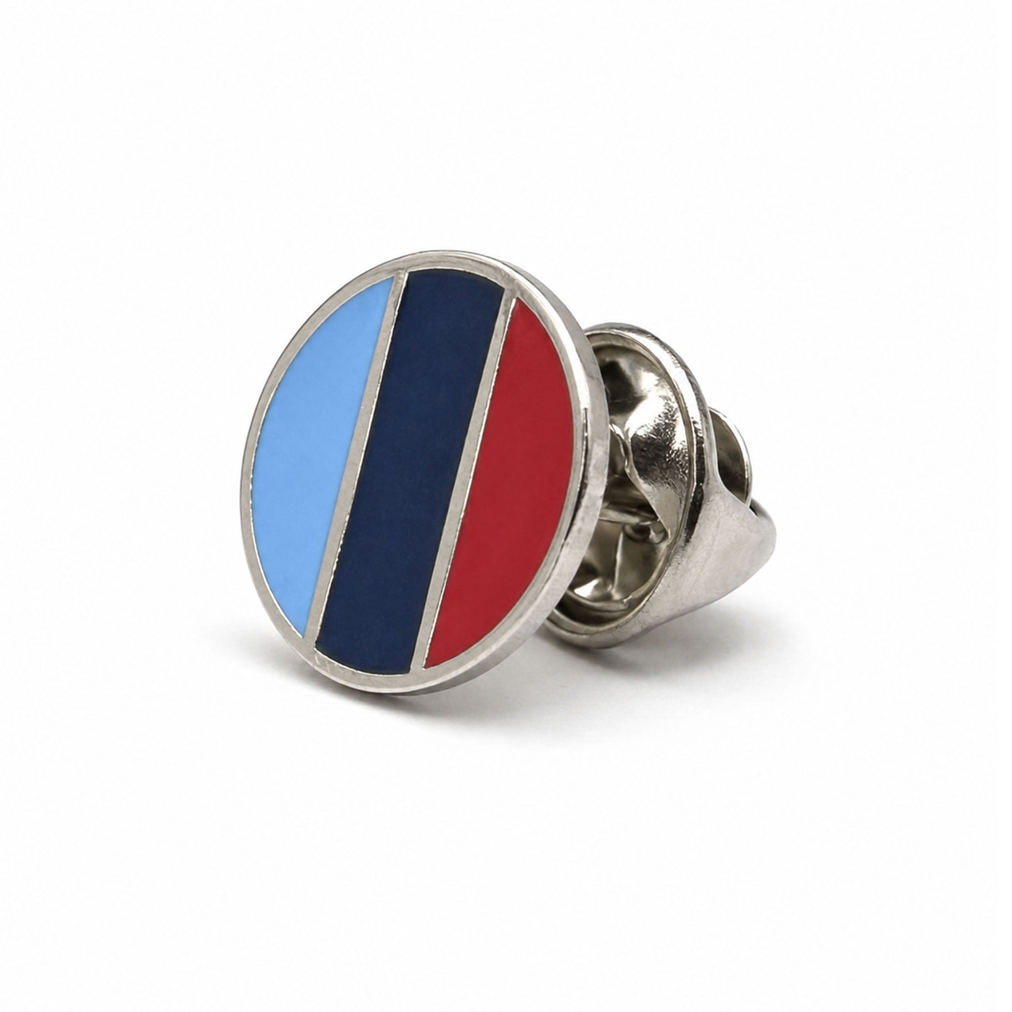 Side view of one journey silver-tone round Masonic lapel pin badge featuring in light blue, dark blue, and red.
