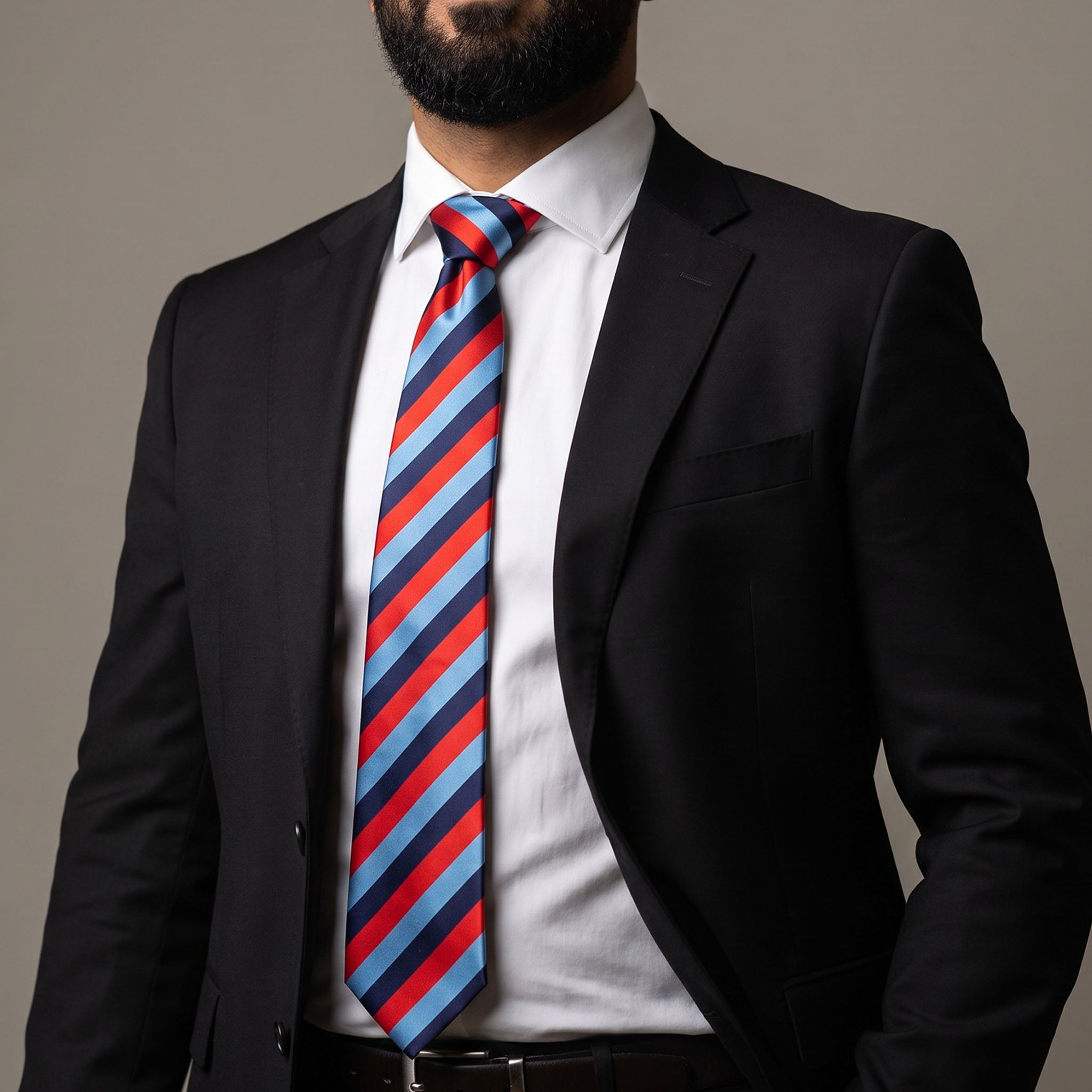 One Journey Masonic tie with a striped light blue, dark blue, and red diagonal rectangle pattern being worn.