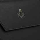 Close-up of gold Square and Compasses emblem on black leather masonic jewel holder