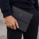 Black leather Masonic jewel holder being carried by hand