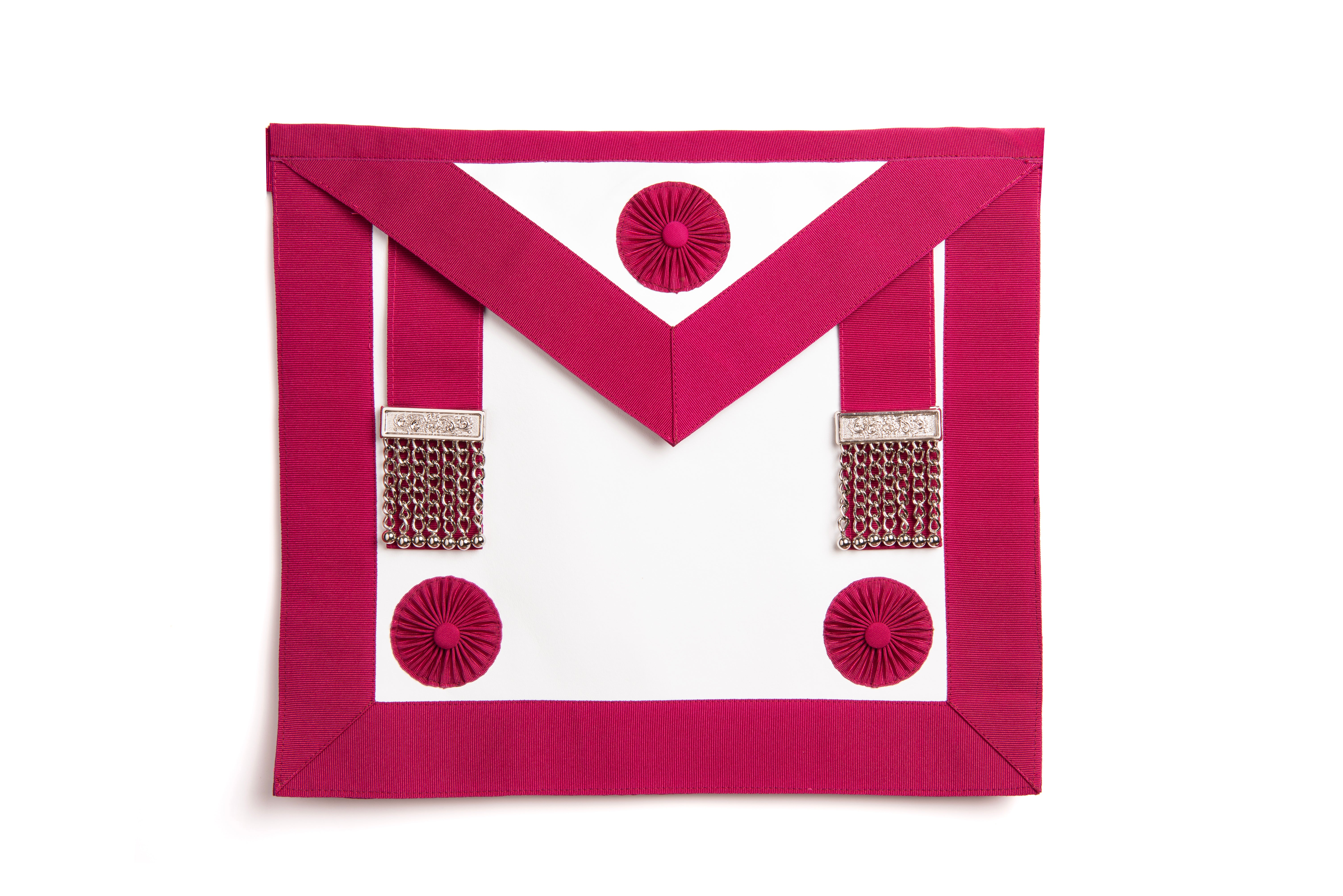 A pink masonic apron with red rosettes and decorative buttons.