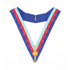A blue, red, and white collarette with a gold-colored emblem and a blue backing.