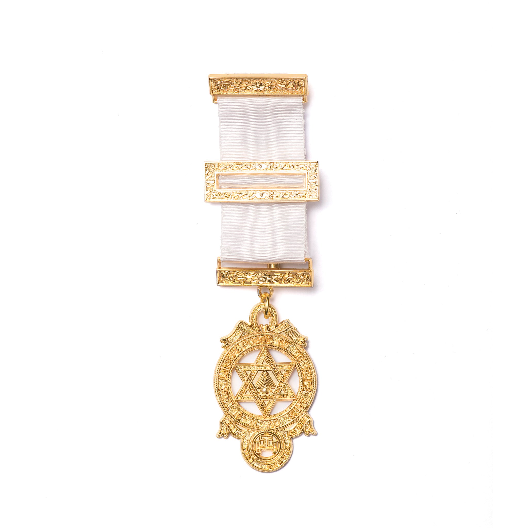 A gold-colored Masonic breast jewel with a white ribbon attachment and intricate detailing.