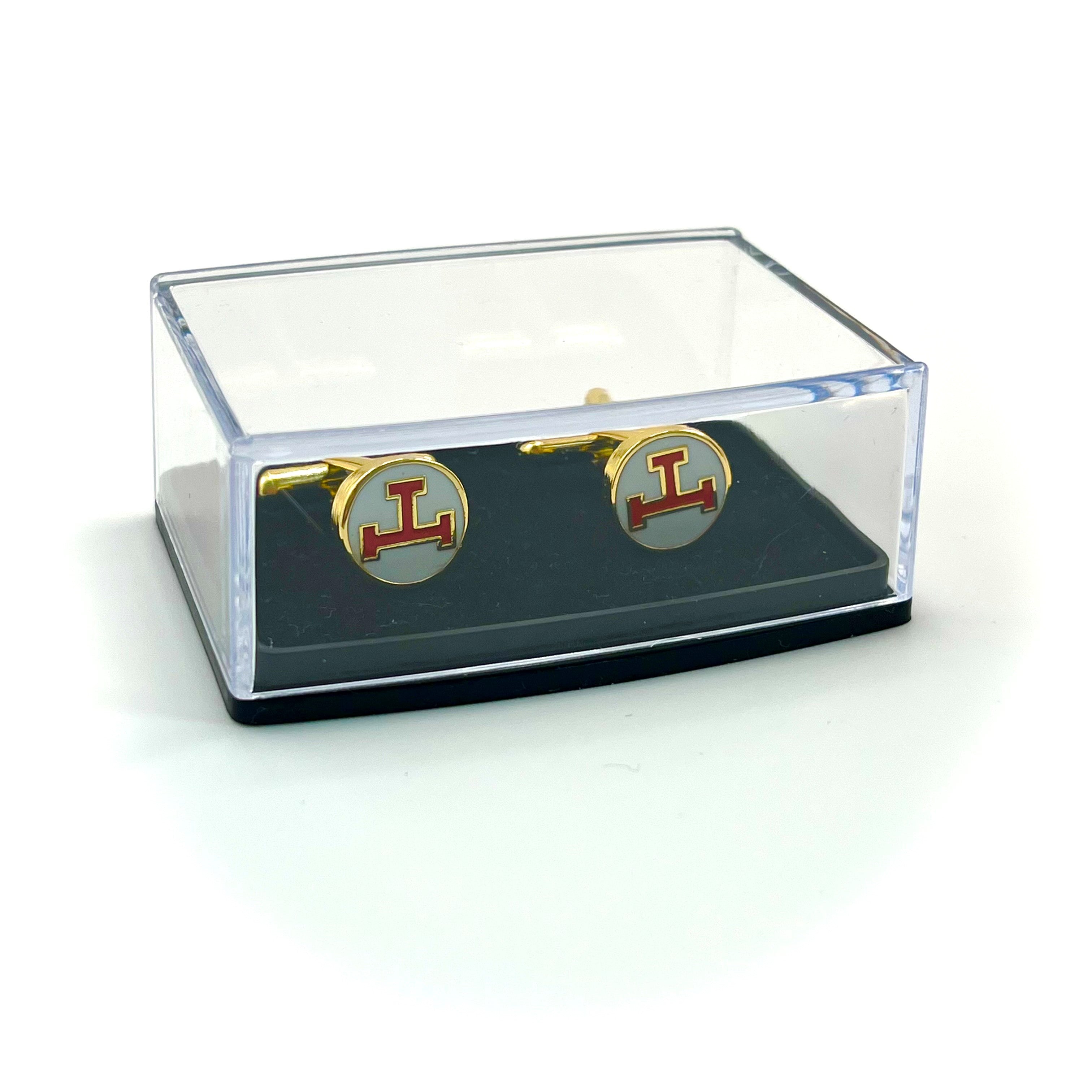 Gold cufflinks with red Royal Arch triple tau logo in agift box on a white background