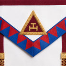 UGLE-approved Masonic Royal Arch Principal apron featuring a white and red front with a gold emblem, red and blue geometric patterns on the sides. Close up image of the Royal Arch symbol