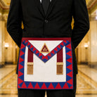UGLE-approved Masonic Royal Arch Principal apron featuring a white and red front with a gold emblem, red and blue geometric patterns on the sides being worn.