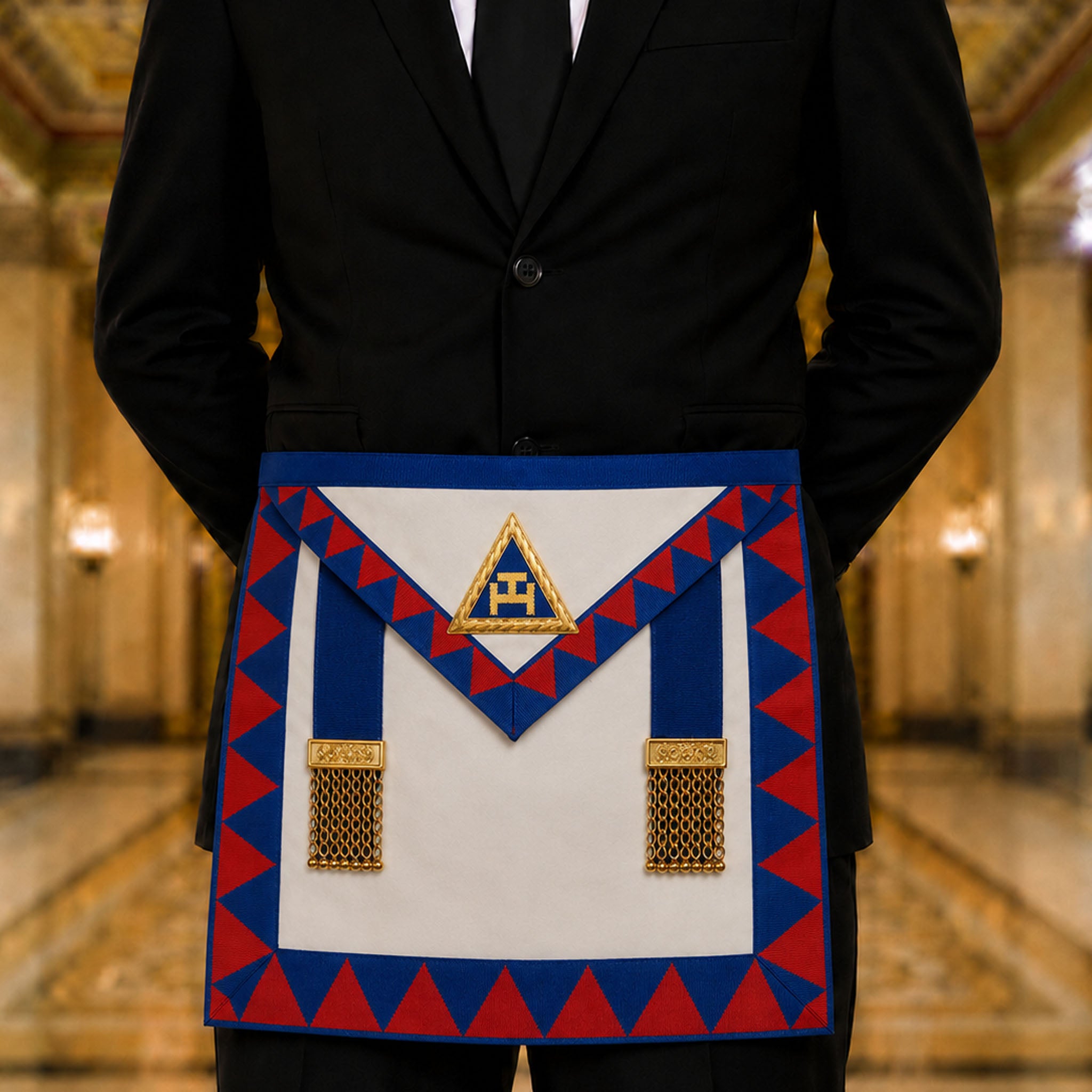 UGLE-approved Masonic Royal Arch Provincial apron featuring a white and blue front with a gold emblem, red and blue geometric patterns on the sides being worn.