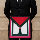 Royal Order of Scotland Masonic apron with red, green and white trim and tassel being worn.