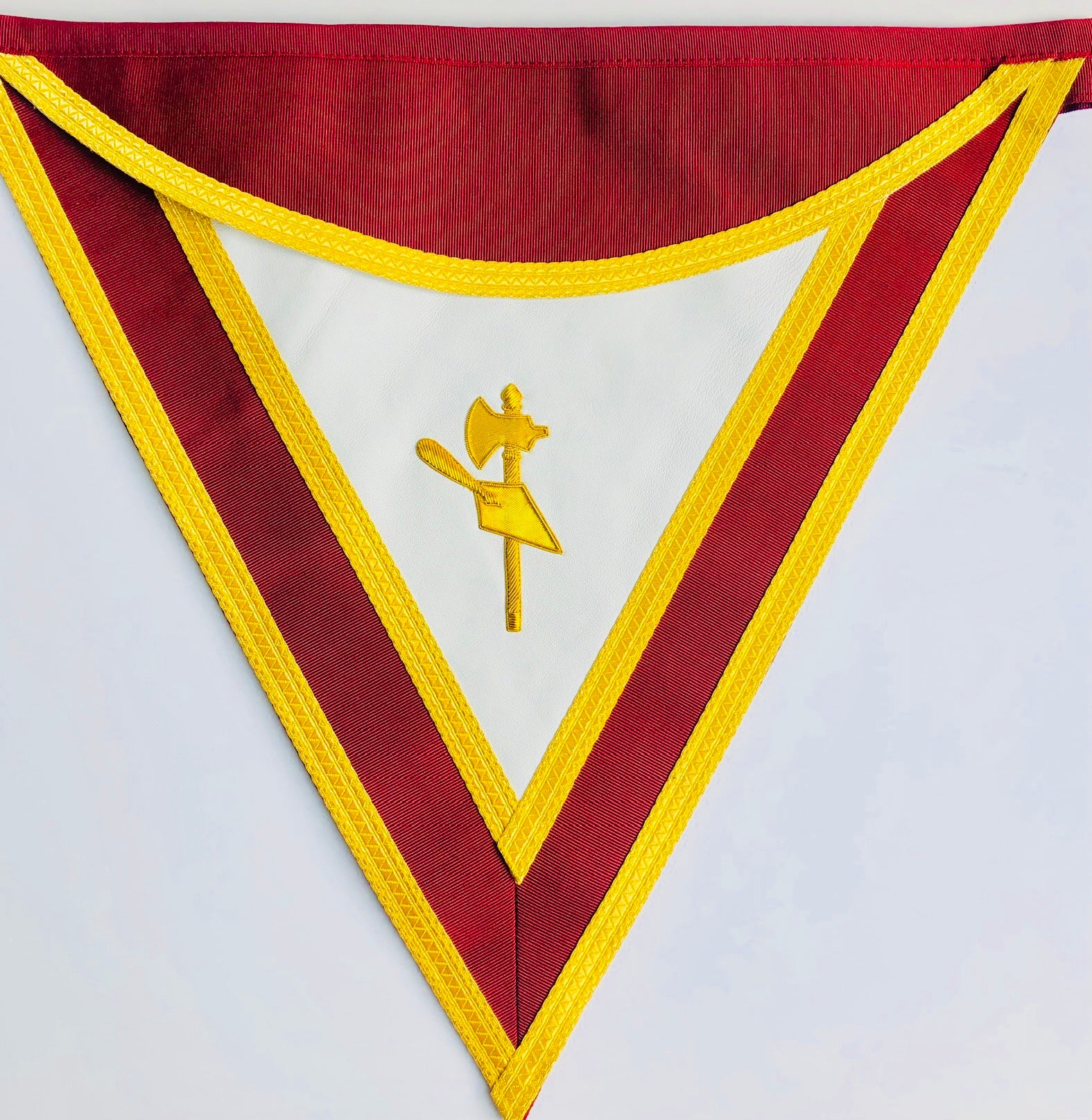 Masonic Apron wiht triangular banner style with red and yellow border and central emblem on a white background
