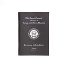 A black Masonic book with a title page featuring the Grand Council of the Order of Royal and Select Masters, including a coat of arms and the year 2020.