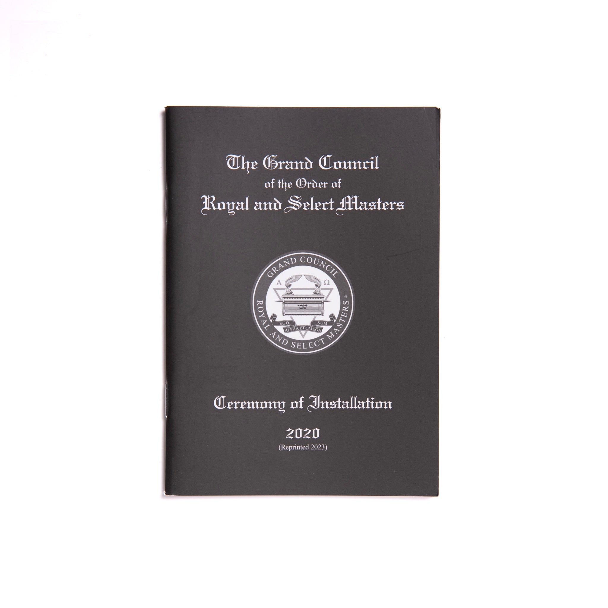 A black Masonic book with a title page featuring the Grand Council of the Order of Royal and Select Masters, including a coat of arms and the year 2020.