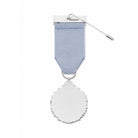 A silver-toned medal with a textured scalloped oval pendant hanging from a light blue ribbon, shown on a plain white background.