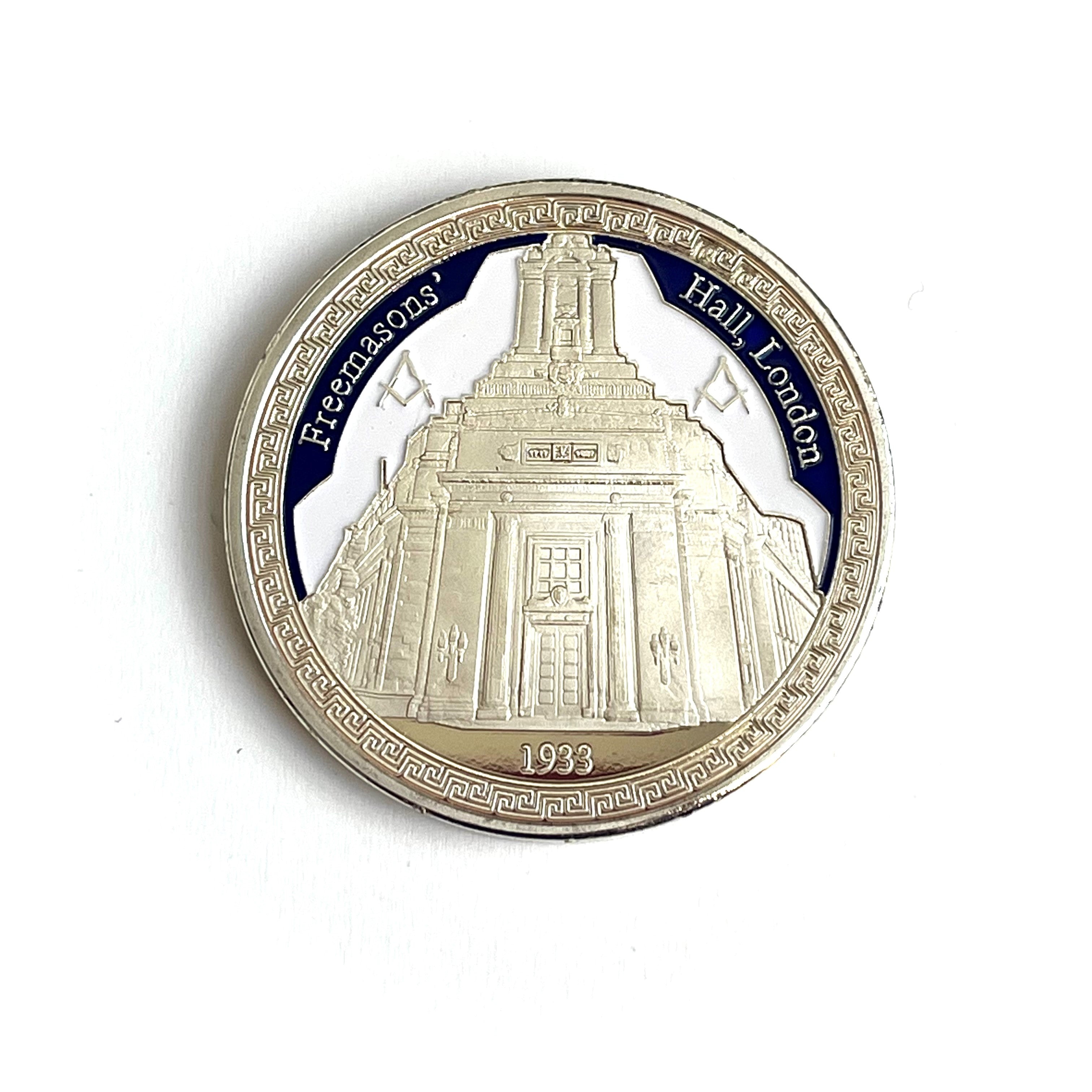 Coin with Freemasons' Hall, London design on a white background
