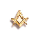 A small gold pin badge featuring the square and compasses symbol.