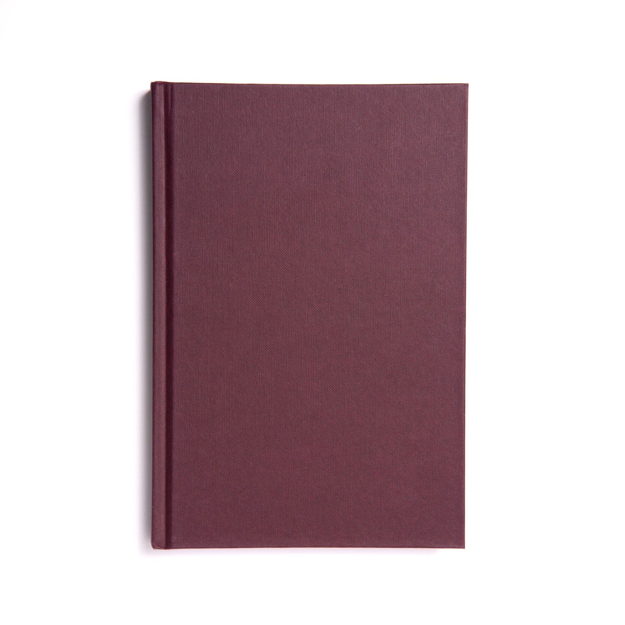 A Masonic closed hardback book with a plain maroon cover, titled 'Taylors Large Print Ritual'.