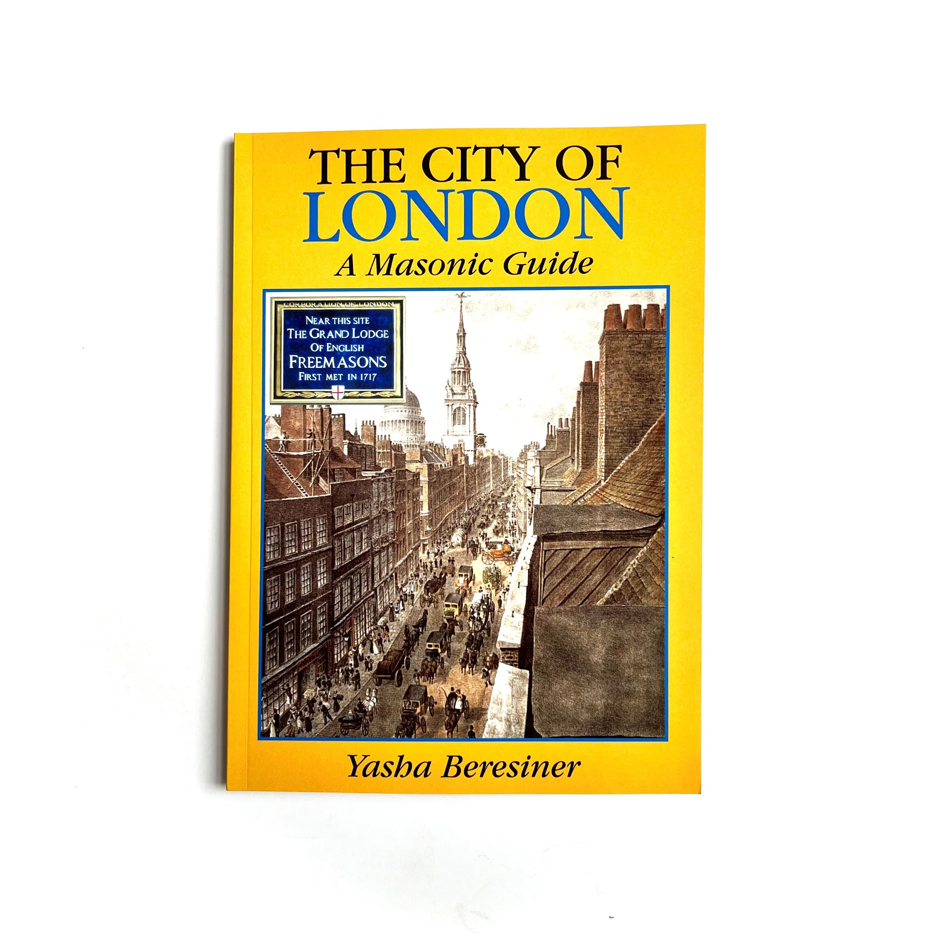 This image features the cover of a book titled "The City of London: A Masonic Guide" by Yasha Beresiner. The cover design includes a historical photograph of a busy London street, capturing the essence of the city's vibrant past.
