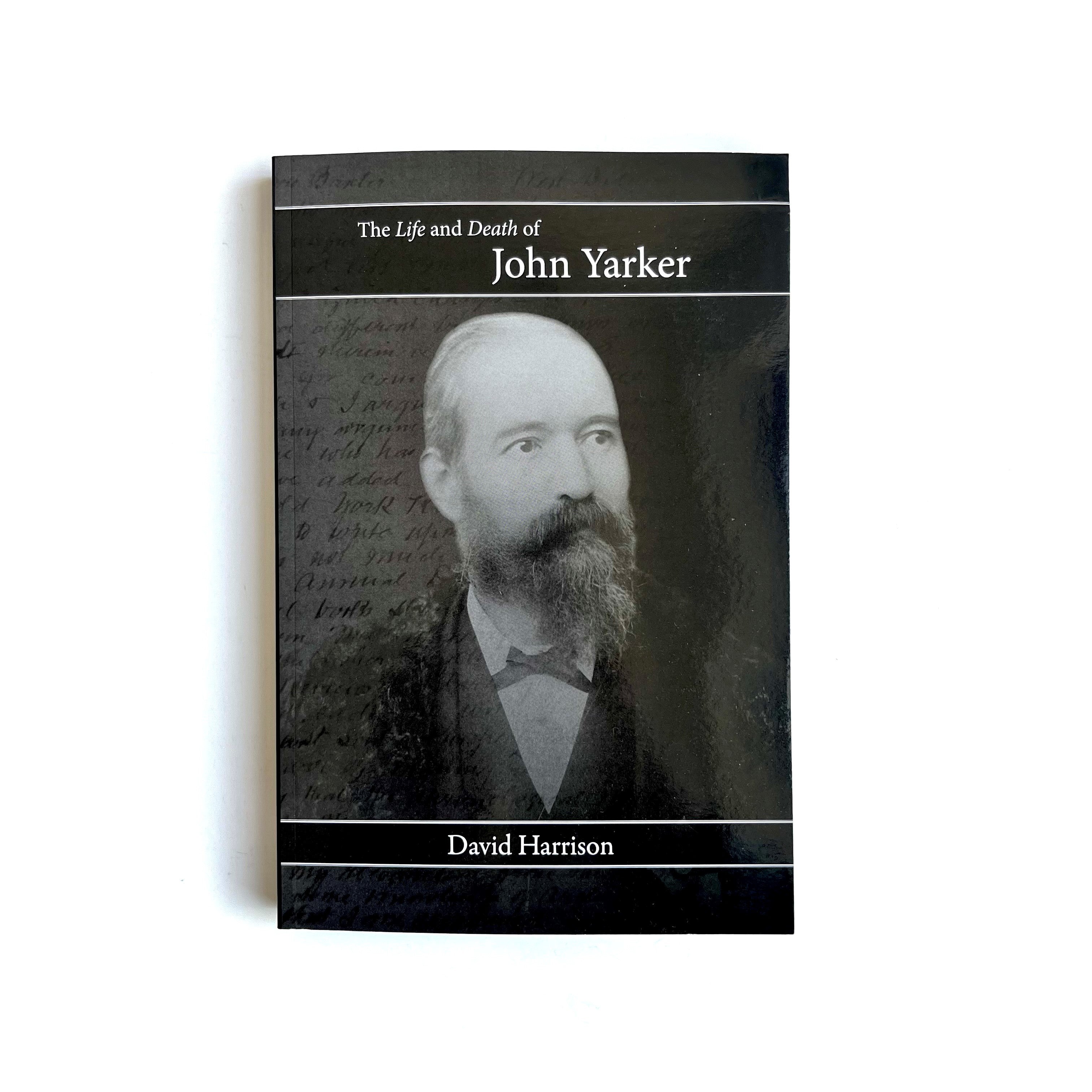 A paperback book with a monochrome photograph of a man with a beard on the cover, titled 'The Life and Death of John Yarker' by David Harrison.