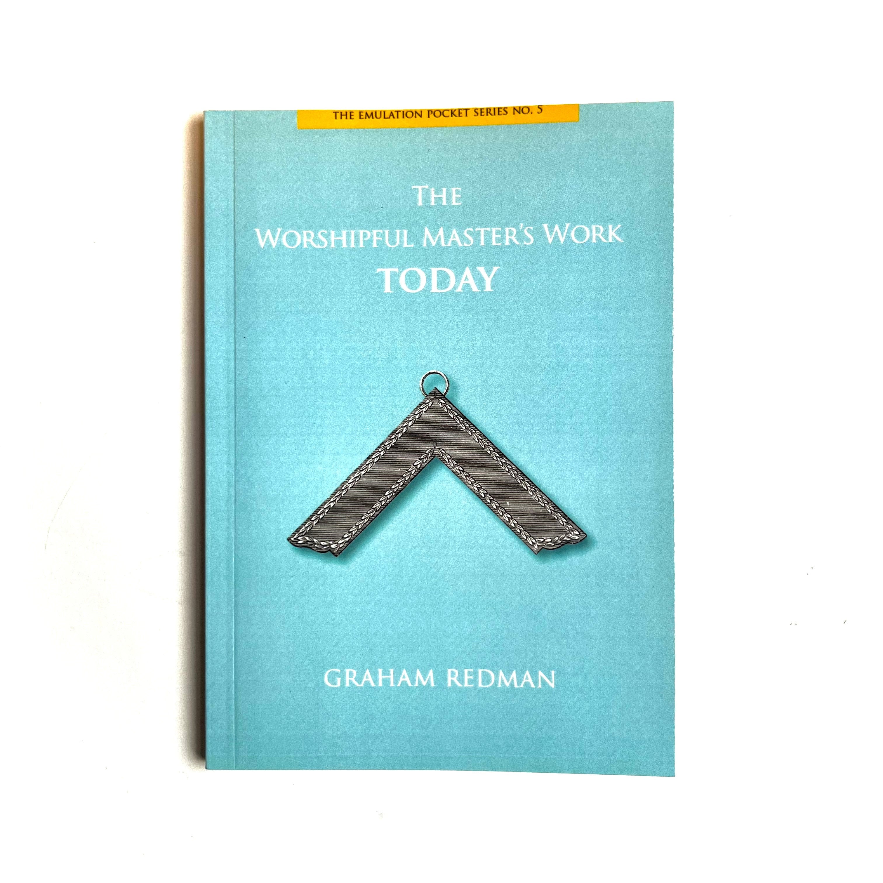 The image shows the cover of a booklet titled 'The Worshipful Master's Work Today' by Graham Redman. The cover is blue with a metallic-looking emblem in the center.