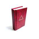 Red book with a gold triangle emblem on a white background