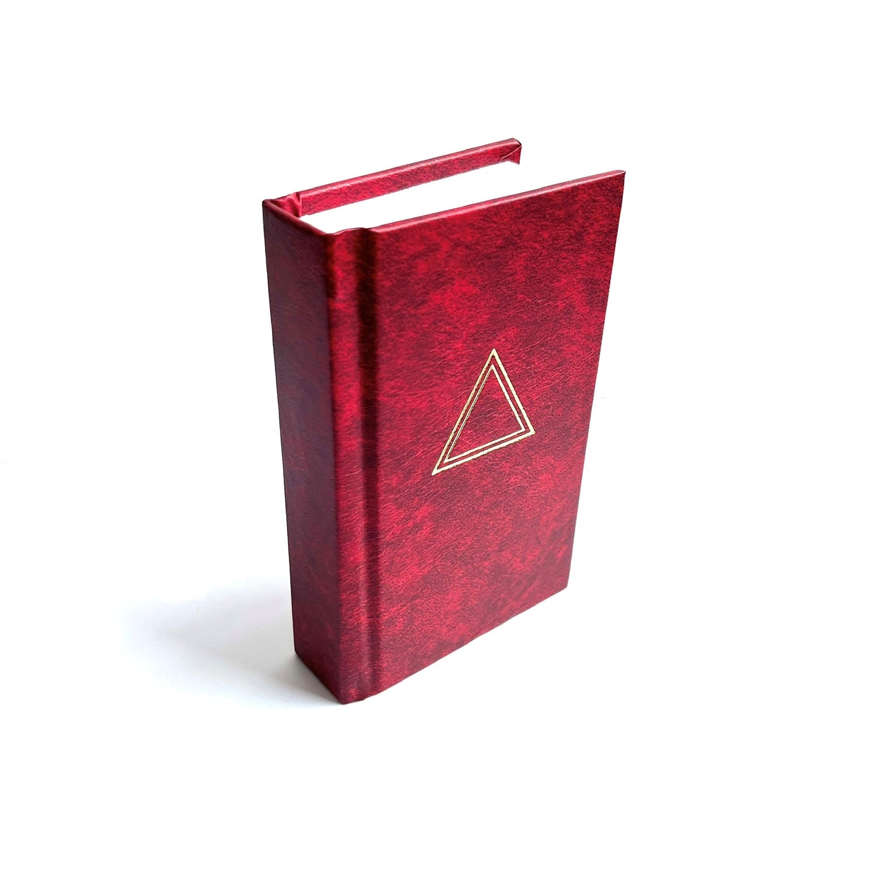 Red book with a gold triangle emblem on a white background