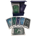 Magnetic Wisdom Cards deck in a dark blue box with several cards fanned out below, showing green, blue, and dark teal card backs with white symbols and text.